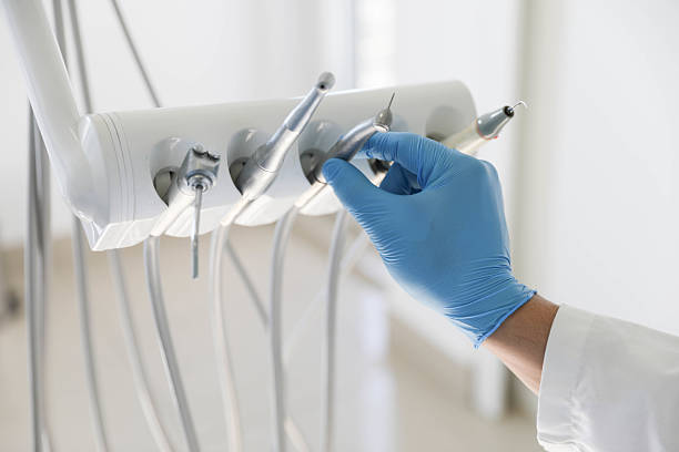 Professional Tooth Extraction technician working in Sawmills, NC